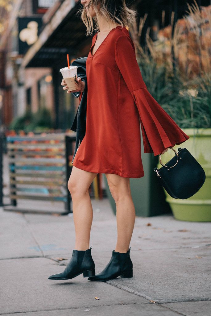 Holiday fashion and red dress with sleeves