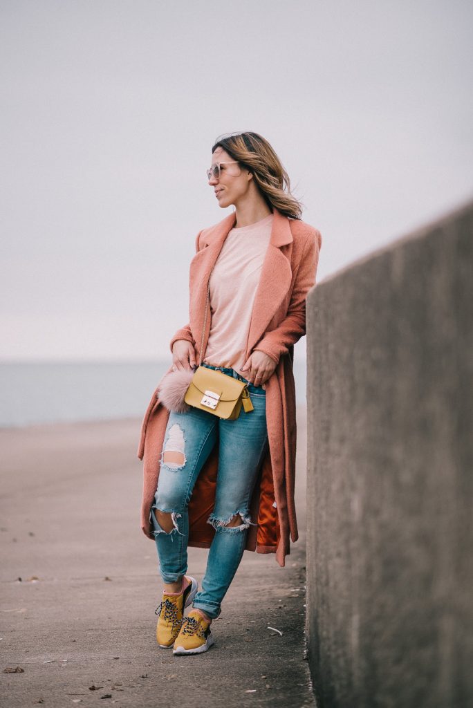 Blogger Mary Krosnjar wearing pink wool coat, who what wear tee and yellow nike roshe