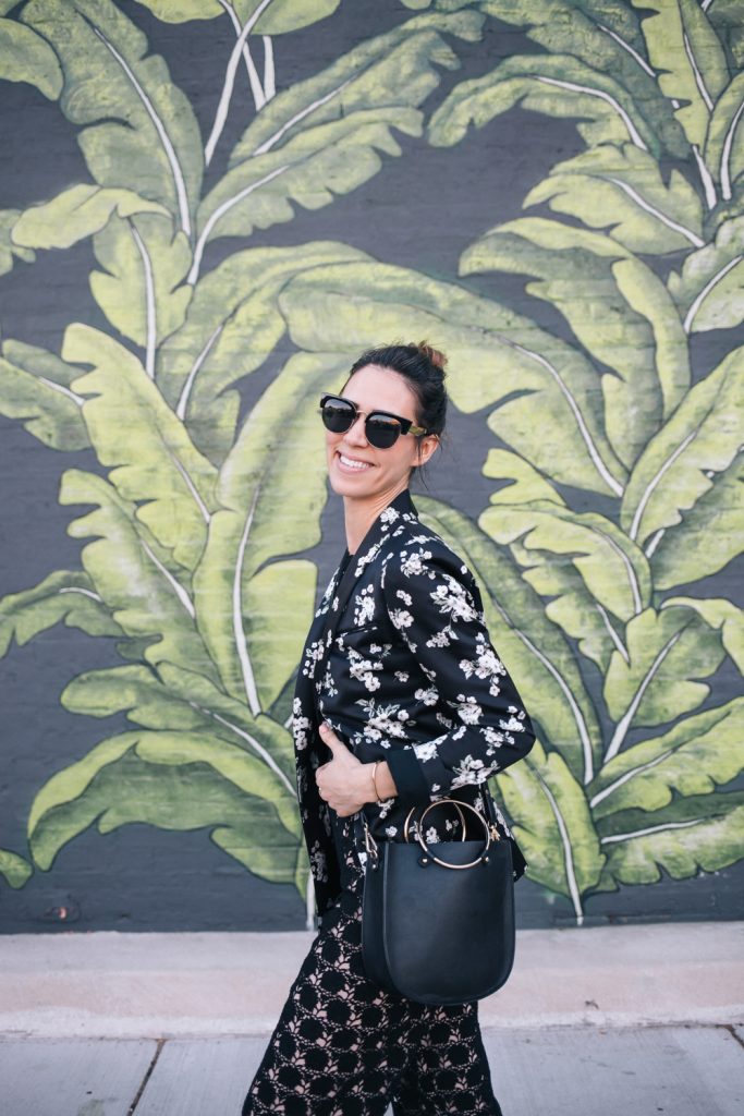 Blogger Mary Krosnjar wearing Floral Blazer and Lace jumpsuit from Rent the Runway