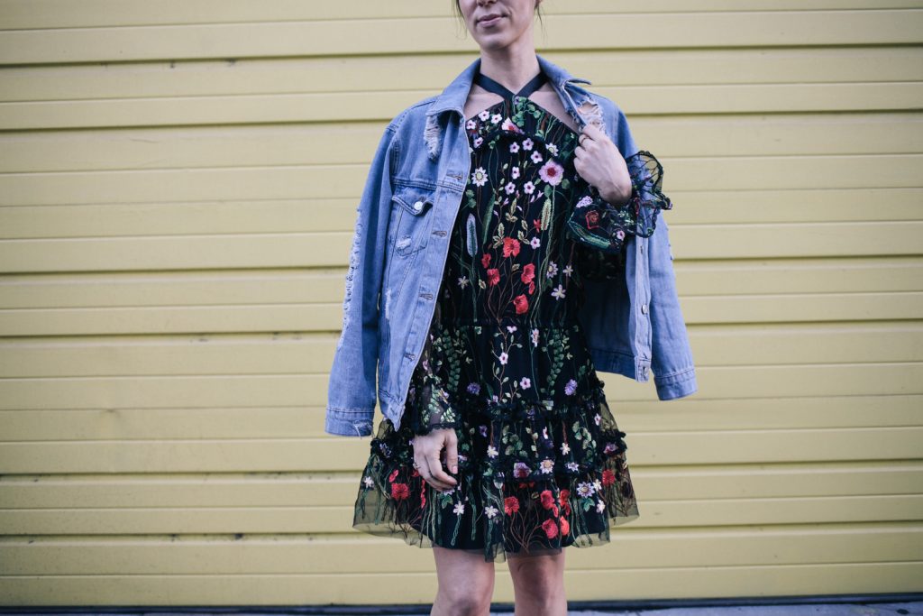 Blogger Mary Krosnjar wearing Black Floral Dress from Rent the Runway and Topshop Distressed denim jacket 