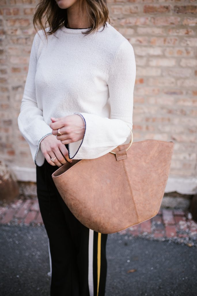 Blogger Mary Krosnjar wearing Who What Wear Suede Tote and Track Pants