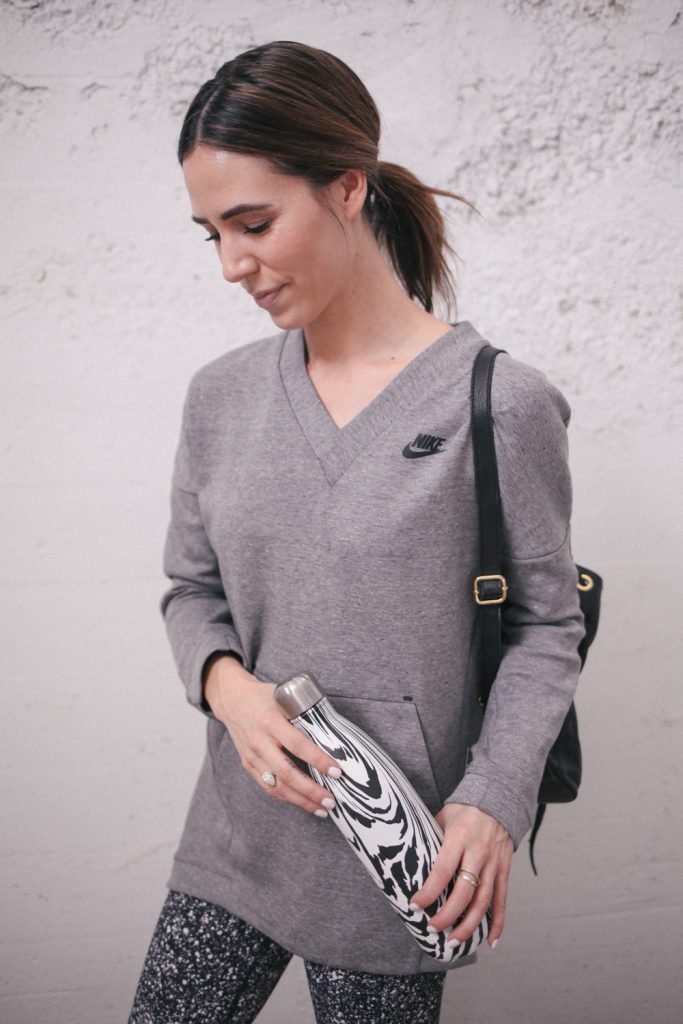 Blogger Mary Krosnjar wearing Nike pullover and Swell water bottle