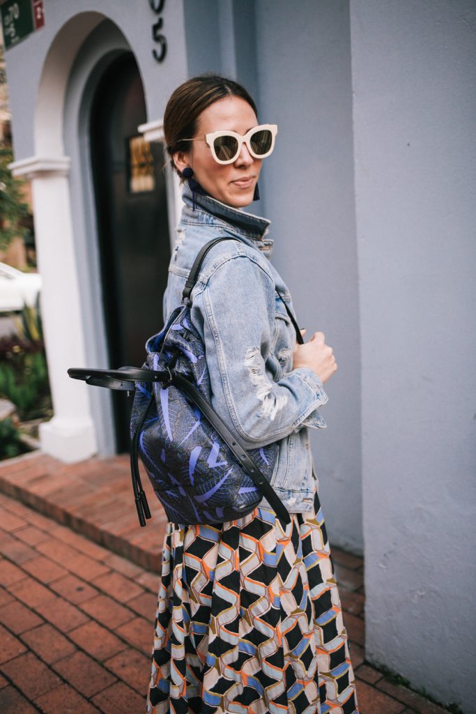 Blogger Mary Krosnjar wearing B.P. mirrored sunglasses and Opening Ceremony Palm Print Backpack