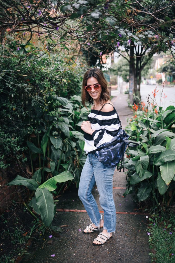 Blogger Mary Krosnjar wearing Opening Ceremony printed backpack and pink LOFT sunglasses