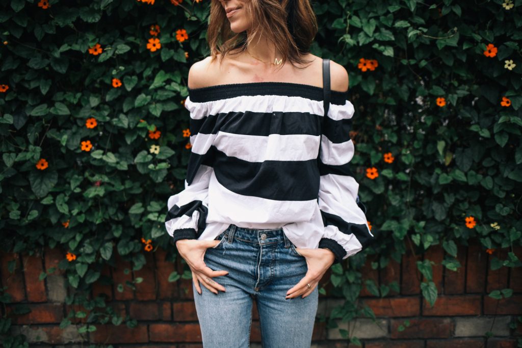 Blogger Mary Krosnjar wearing MLM Label Off the Shoulder Top and H&M High-waisted denim
