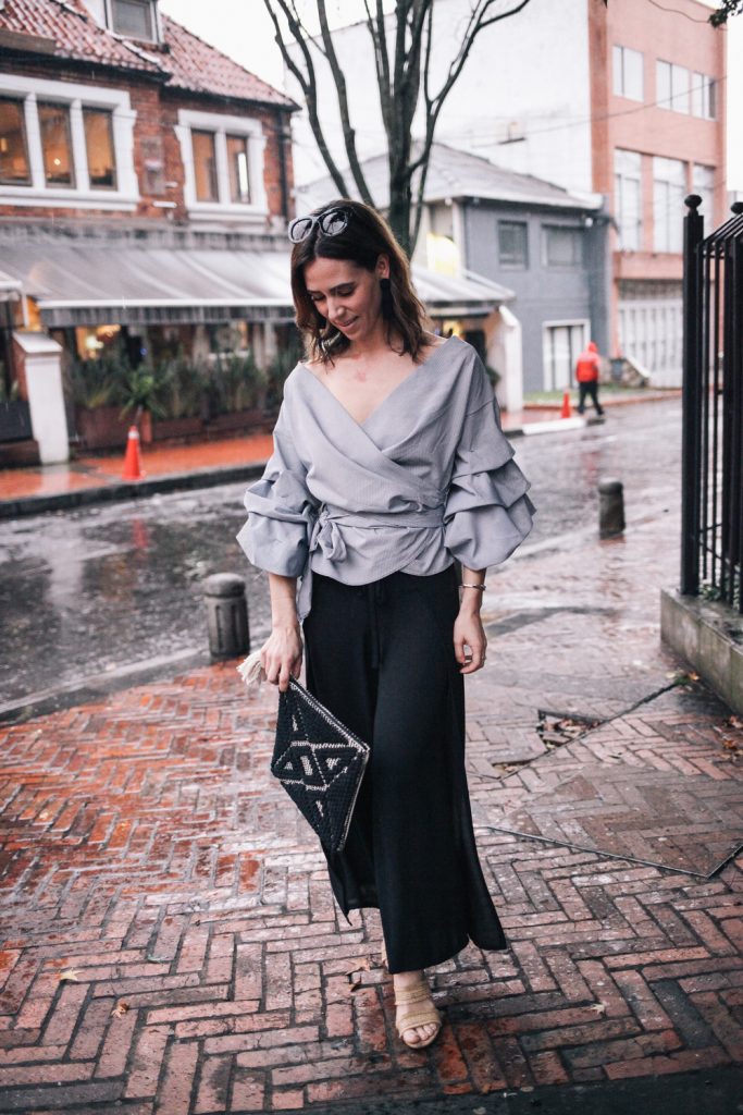 Blogger Mary Krosnjar wearing ruffled sleeved top and Bailey 44 cropped pants