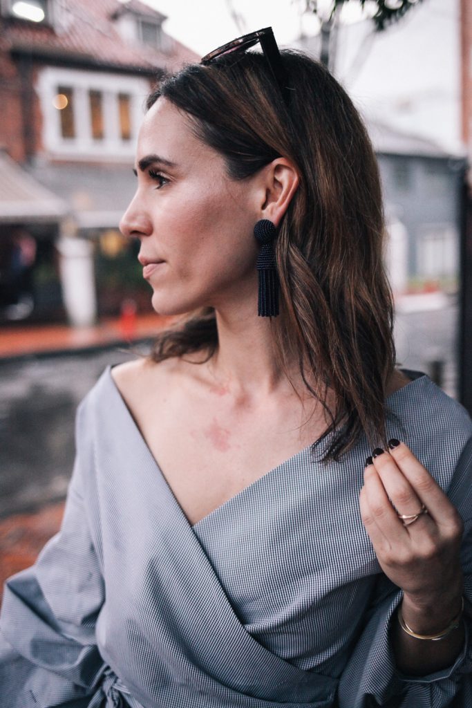 Blogger Mary Krosnjar Wrap ruffle sleeve top and oscar de le renta earrings