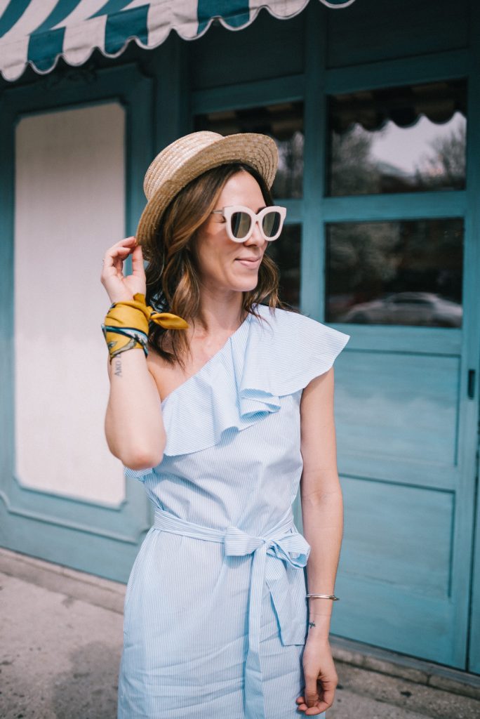 Blogger Mary krosnjar wearing Sole Society straw hat and One Shoulder Mini Dress with Belt