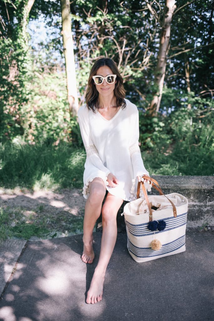 Blogger Mary Krosnjar wearing white beach cover-up in Seattle