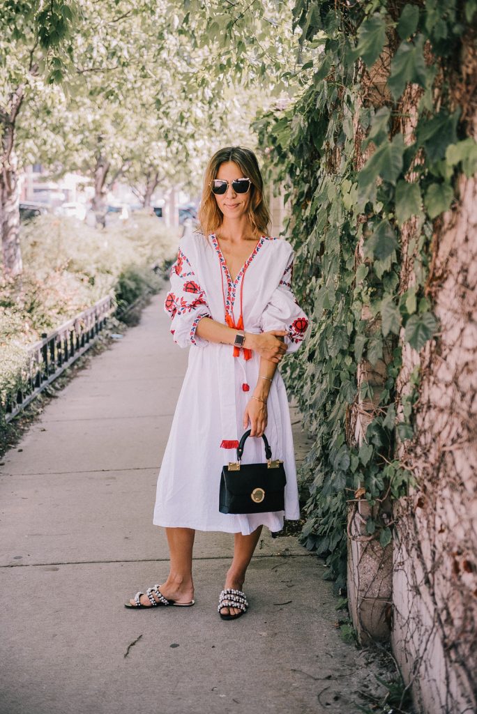 Blogger mary krosnjar wearing Tassel Tied Embroidery Dress, Zara pearl embellished sandals and Foley and Corina satchel