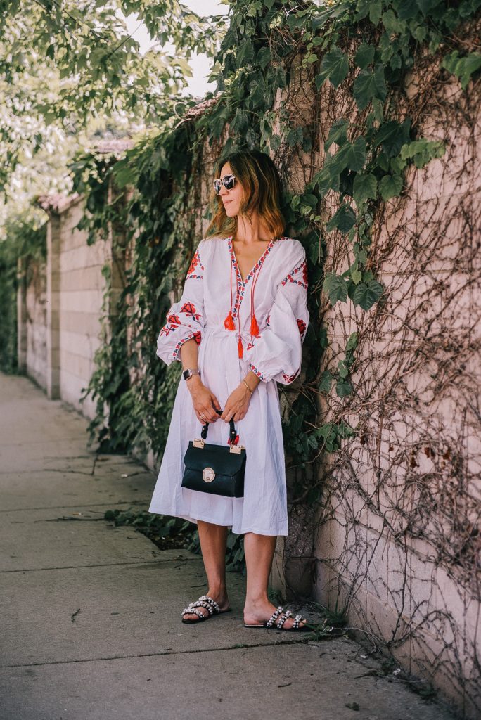 Blogger Mary Krosnjar wearing Tassel Tied Embroidery Dress and pearl embellished sandals