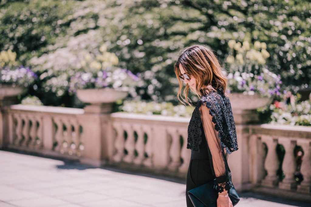 Blogger Mary Krosnjar wearing Black and Lace jumpsuit under $50
