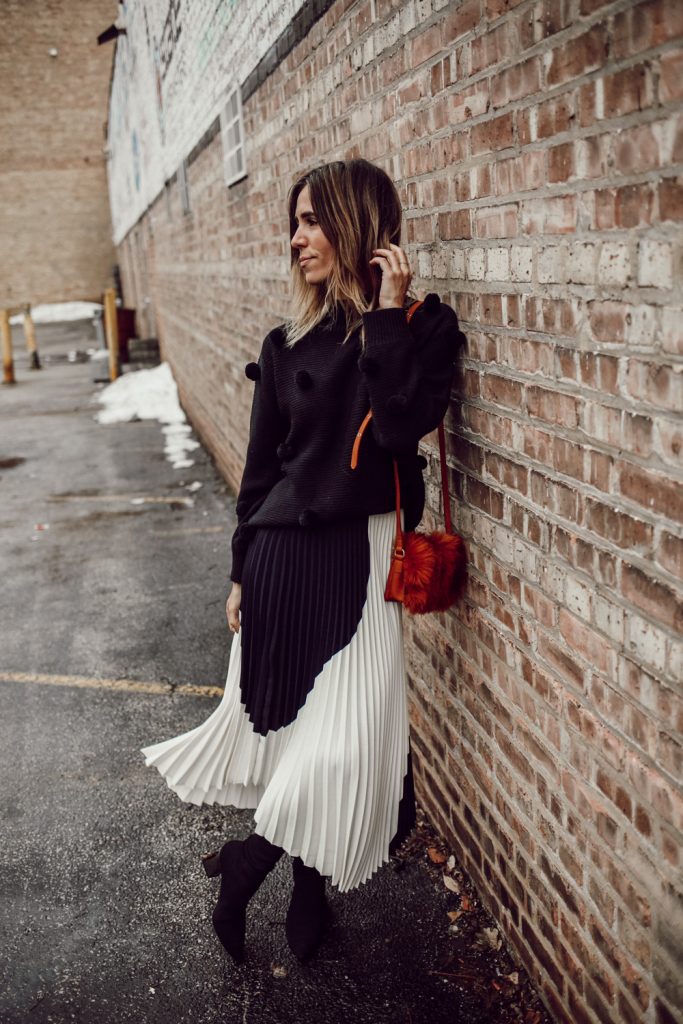 Rachel Parcell Black Pom Pom Sweater and H&M pleated skirt