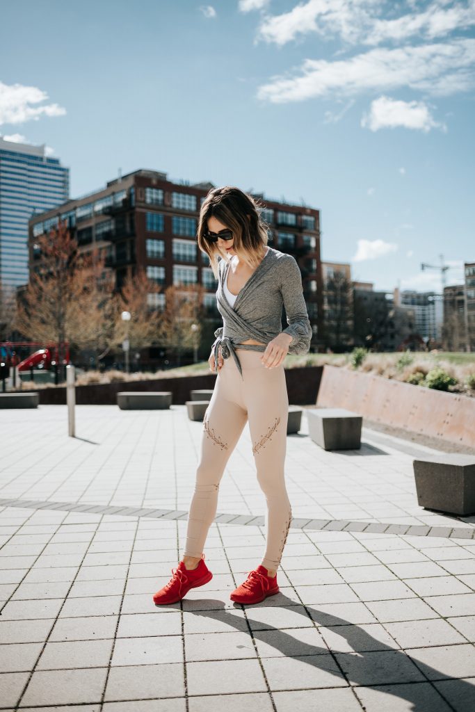 Blogger Mary Krosnjar wearing APL Red Sneakers