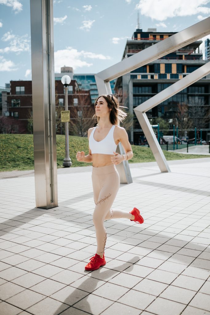 Blogger Mary Krosnjar wearing APL Sneakers and Contour lace up leggings