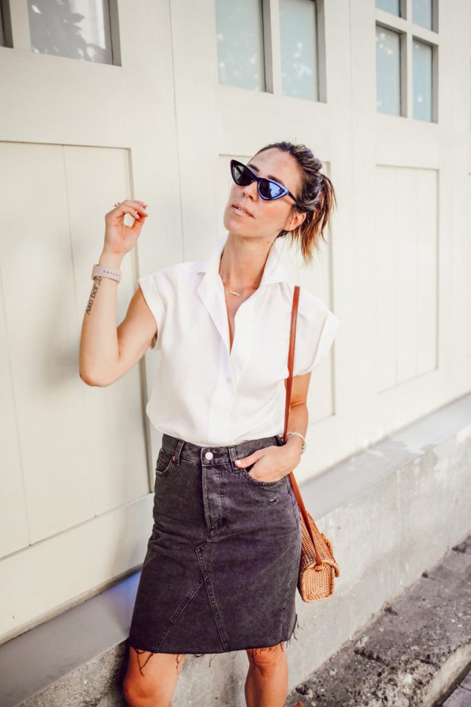 Blogger Mary Krosnjar wearing white blouse and H&M Black denim skirt