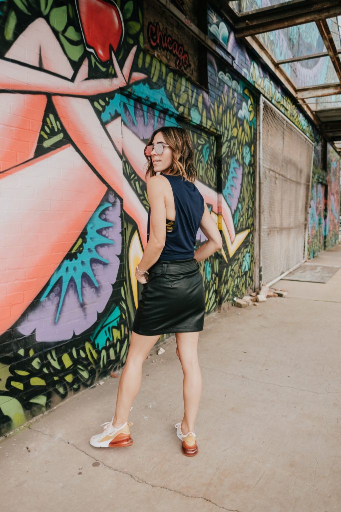 Blogger Mary Krosnjar wearing Topshop Faux Leather Mini skirt and WVU muscle tank