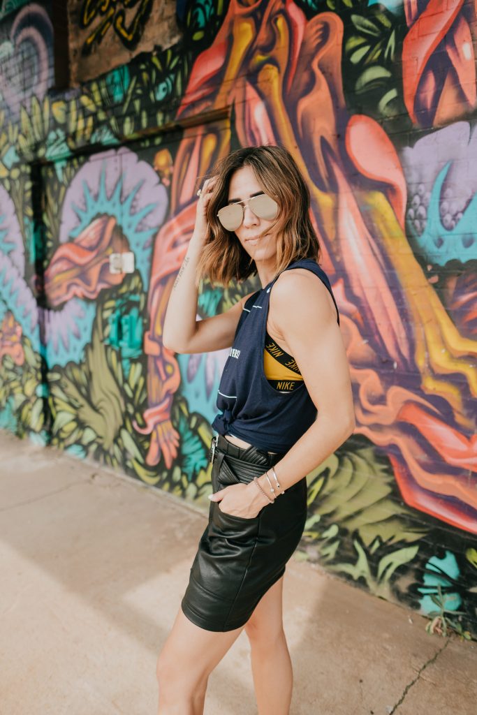 Blogger Mary Krosnjar wearing WVU muscle Tank and Le Specs Mirrored Sunglasses