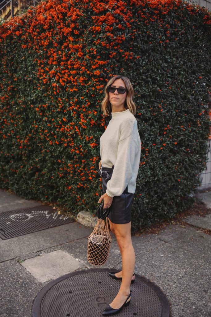 Blogger Mary Krosnjar wearing Balloon Sleeve Sweater and Topshop Faux Mini Skirt
