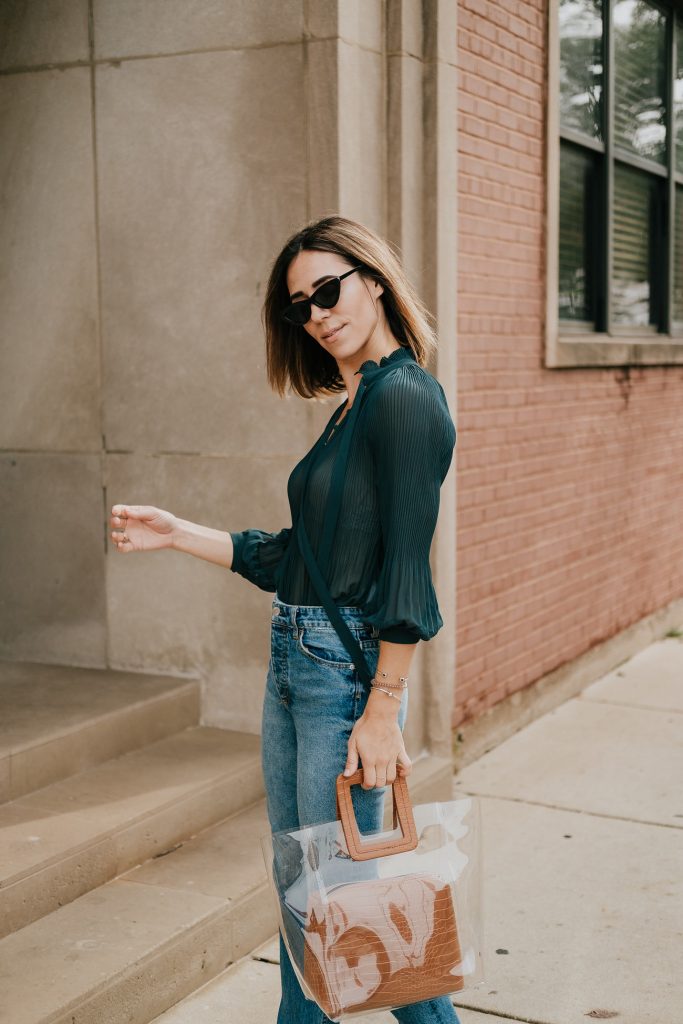 Blogger Mary Krosnjar wearing Neck Tie Bodysuit and Clear Bag