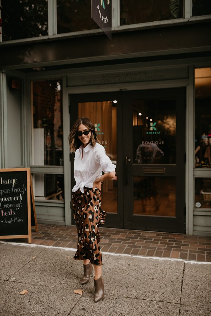 Seattle Fashion Blogger Sportsanista wearing White Collared Blouse and Leopard Pleated Skirt from JcPenny for Work