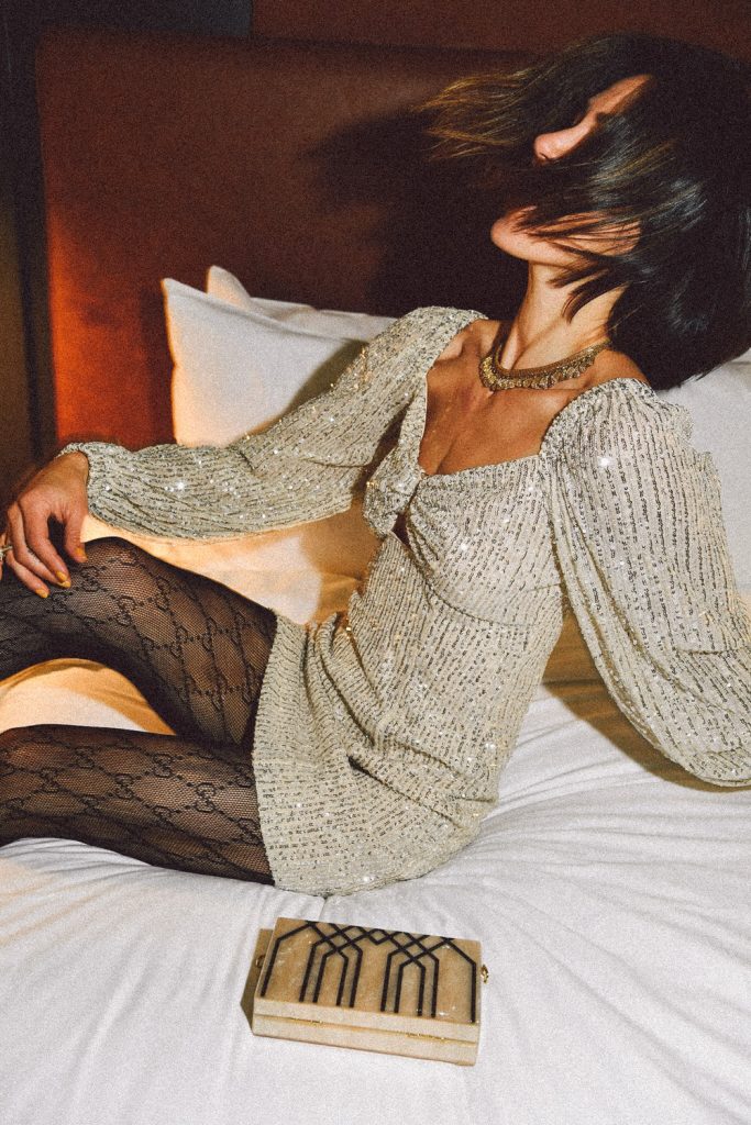 Blogger Mary Krosnjar wearing Lustre Long Sleeve Sequin Mini Dress and Gucci interlocking tights
