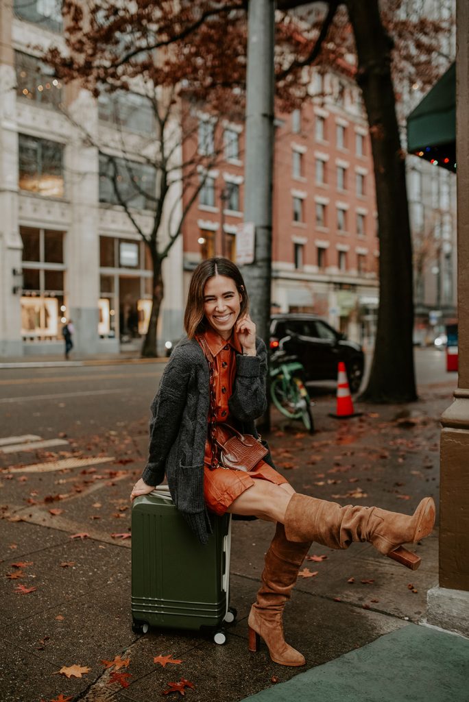 Blogger Mary Krosnjar wearing Who What Wear Faux Leather Dress and J.Crew Oversized Cardigan with Tall Suede Brown Boots