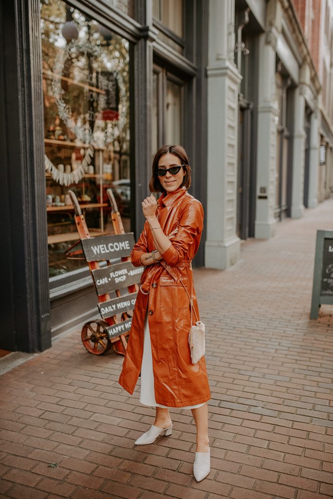 Blogger Mary Krosnjar wearing Vinyl Trench Coat and Cream Slip Dress