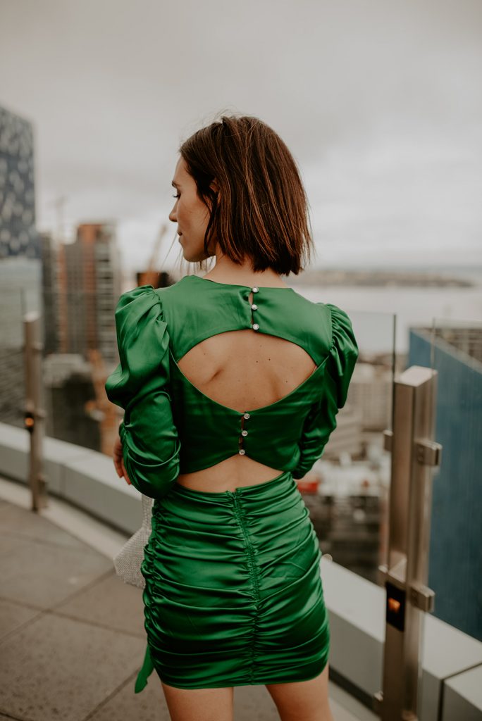 Blogger Mary Krosnjar wearing open back satin dress for new years eve