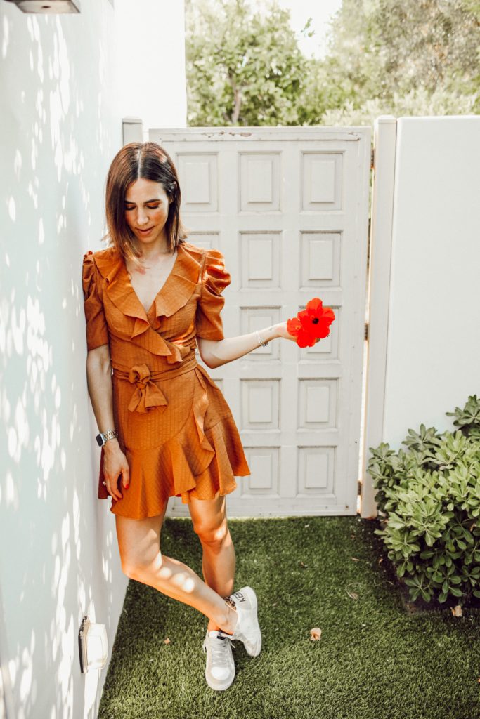 Blogger Sportsanista wearing Ruffle Trim Mini Dress and Golden Goose Sneakers