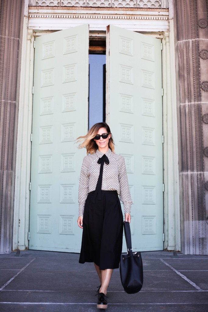 Wayf Tie Neck Button Front Blouse, 424 Fifth Culottes, Black Cat Eye Sunglasses, Black Leather Bucket Bag, Shellys Black Patent Cork Platform Shoes