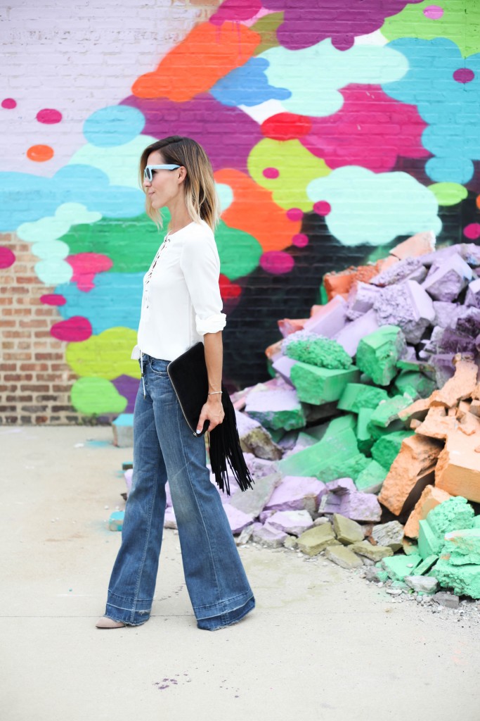 Nasty Gal Lace up Blouse, Flare denim, Vince Camuto Mushroom taupe booties, & Other Stories Sunglasses, Fringe clutch, Center for lost Art, Chicago street art, 70's fashion, 70's inspired fashion