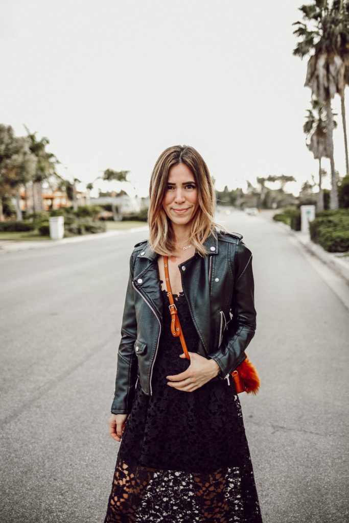 Blogger Mary Krosnjar wearing Blank NYC Denim Moto Jacket and ASTR Lace Midi Dress