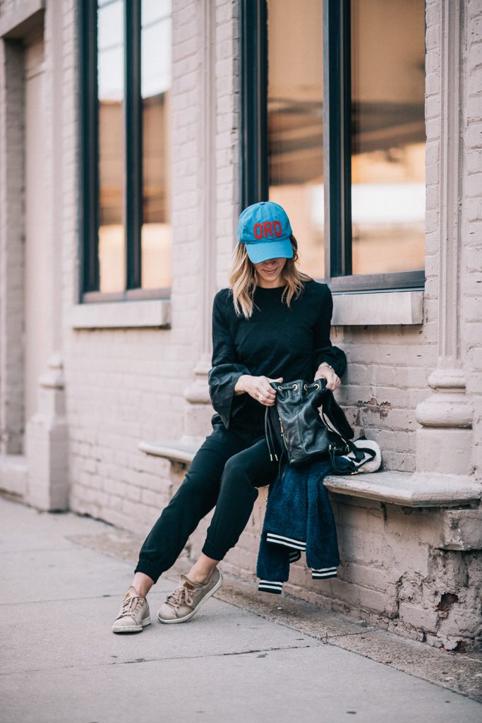 Blogger Mary Krosnjar wearing Linea Pelle Leather backpack and Ann Taylor joggers