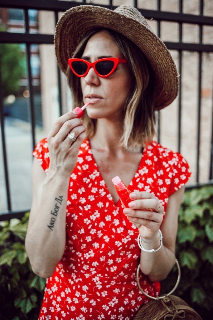 Blogger Mary Krosnjar wearing J.Crew wrap dress and red cat eye sunglasses