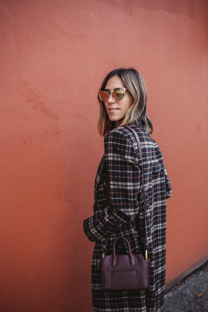 Blogger Mary Krosnjar wearing C/MEO Magnets Coat in Black Check and Tom Ford Gold Cat Eye Sunglasses