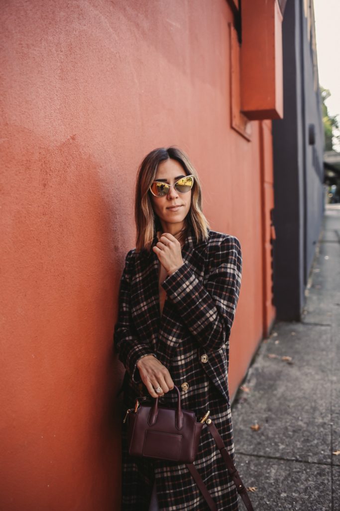 Blogger Mary Krosnjar wearing C/MEO Magnets Coat in Black Check and Tom Ford Gold Cat Eye Sunglasses