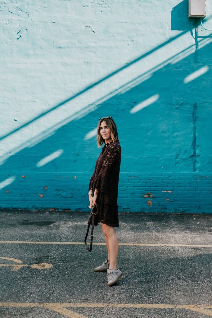 Blogger Mary Krosnjar wearing Burgundy Lace Dress and Golden Goose Sneakers