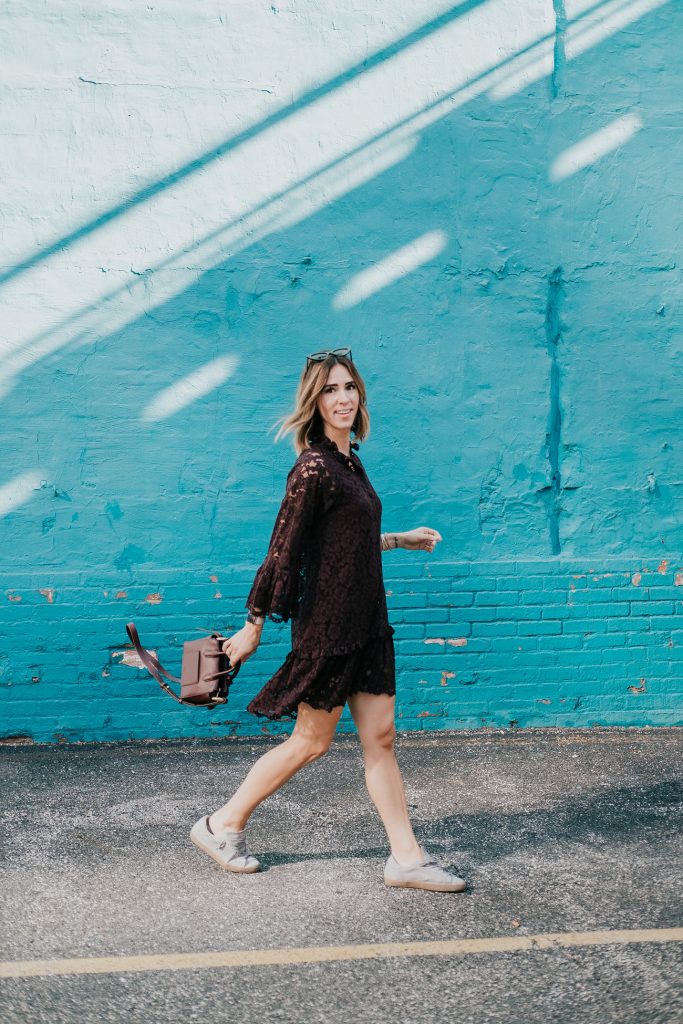 Blogger Mary Krosnjar wearing Burgundy Lace Dress and Golden Goose Sneakers