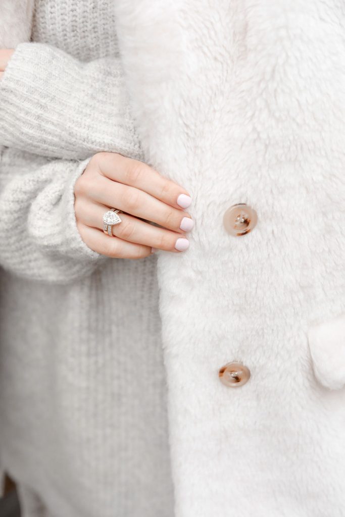 Blogger Sportsanista wearing Teddy Faux Fur Jacket and Diamond Pear Shaped Engagement Ring