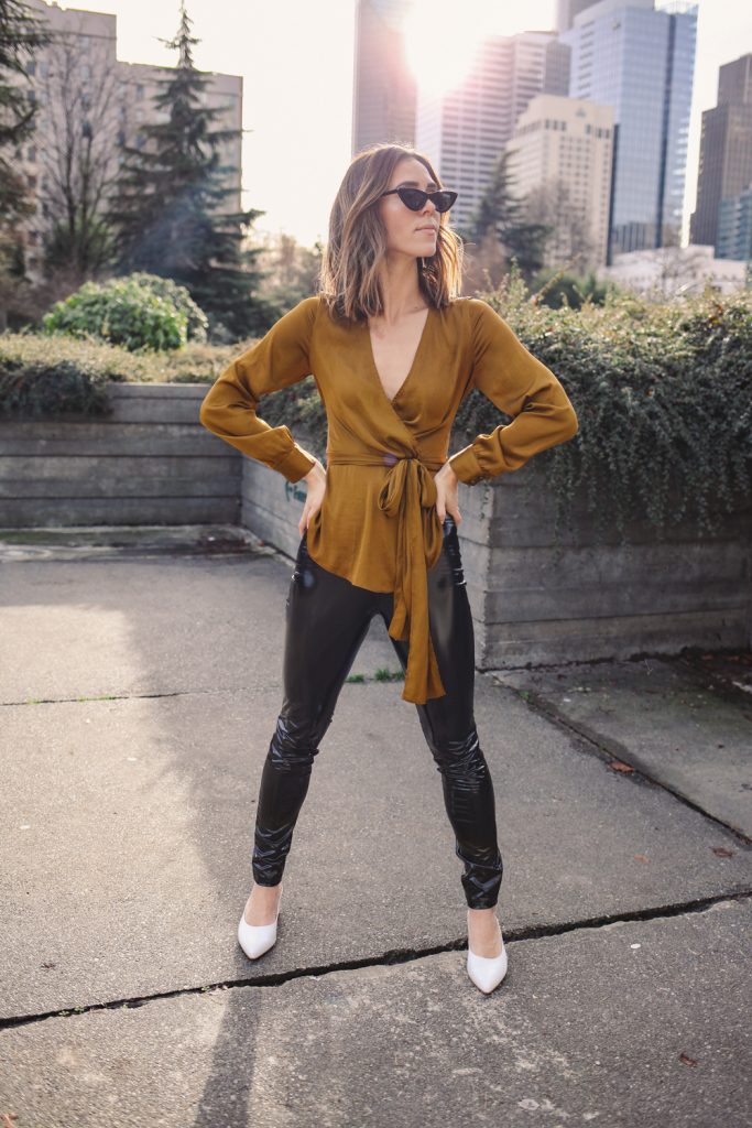 Blogger Sportsanista wearing Anthropologie Brynn Tie-Front Blouse and H&M Patent Treggings 