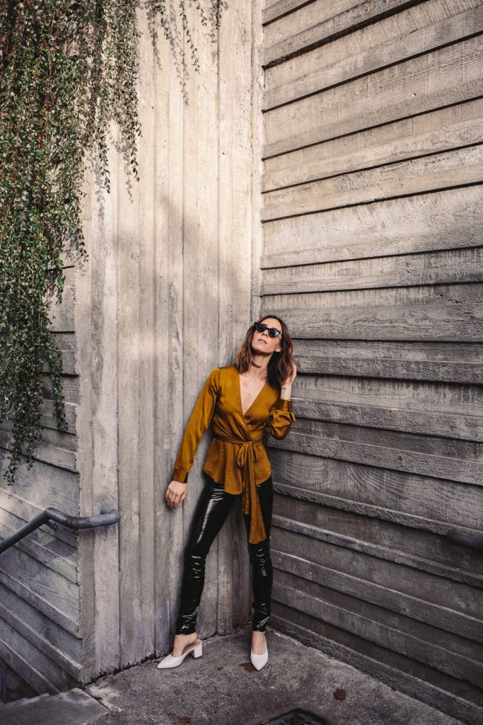 Blogger Mary Krosnjar wearing Anthropologie Brynn Tie-Front Blouse and H&M Black Patent Treggings