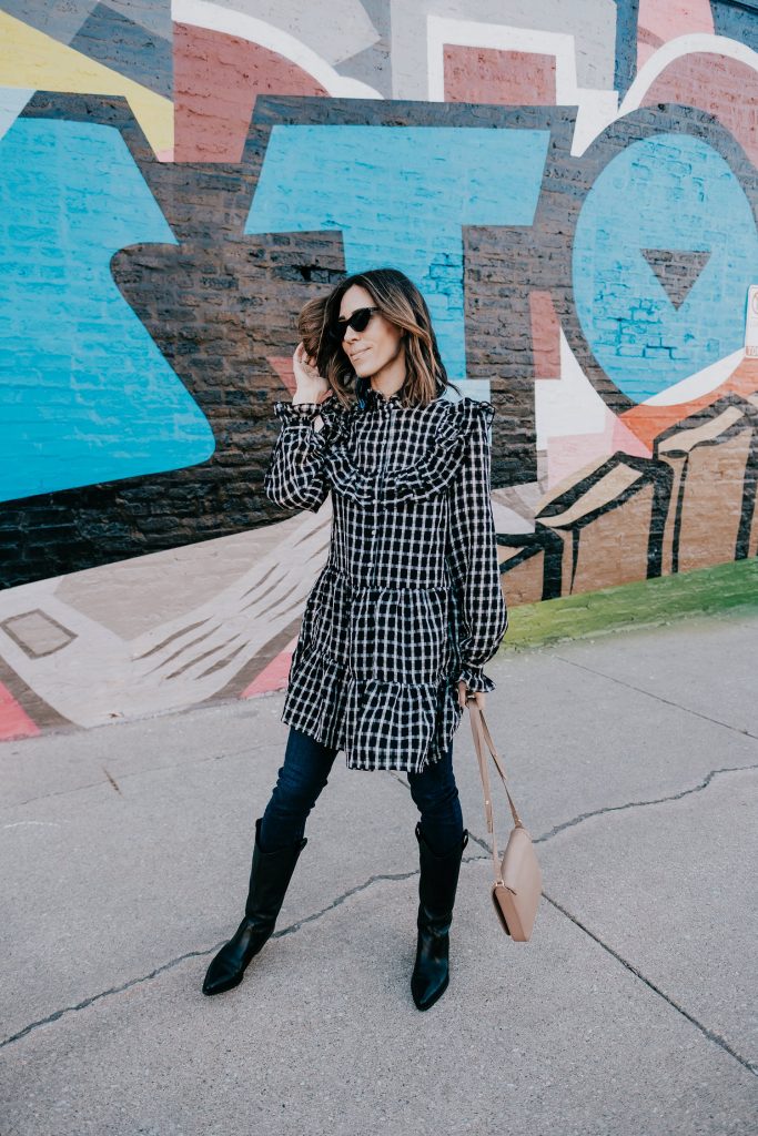 Seattle Fashion Blogger Sportsanista sharing how to wear a dress over jeans and western styled boots