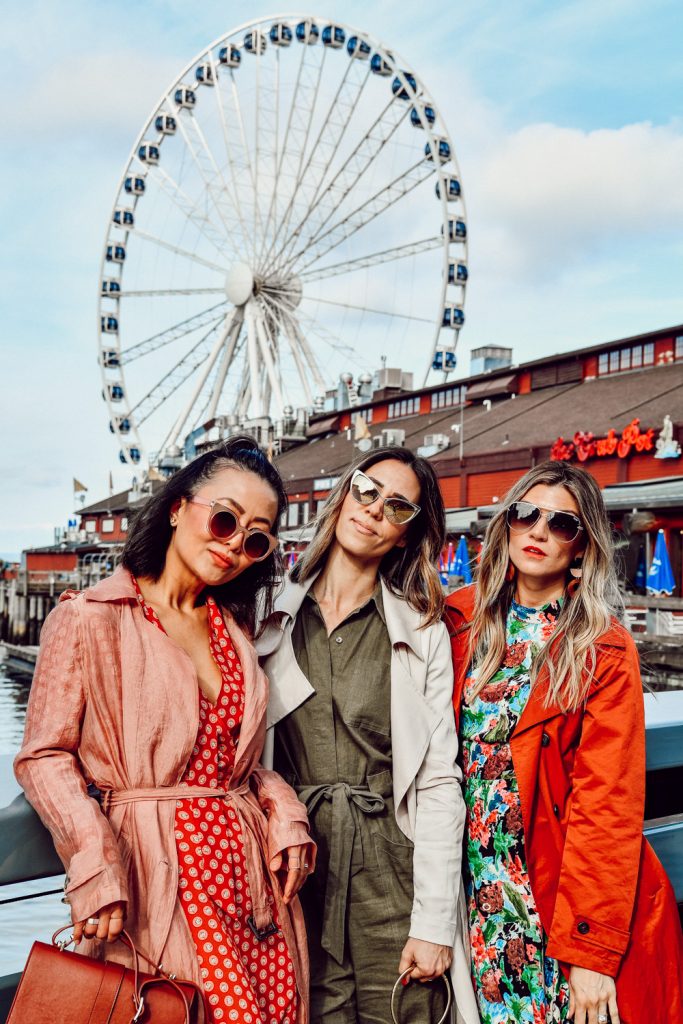 E for Elisa, The Grey Edit and Sportsanista wearing trench coats at the Seattle Great Wheel