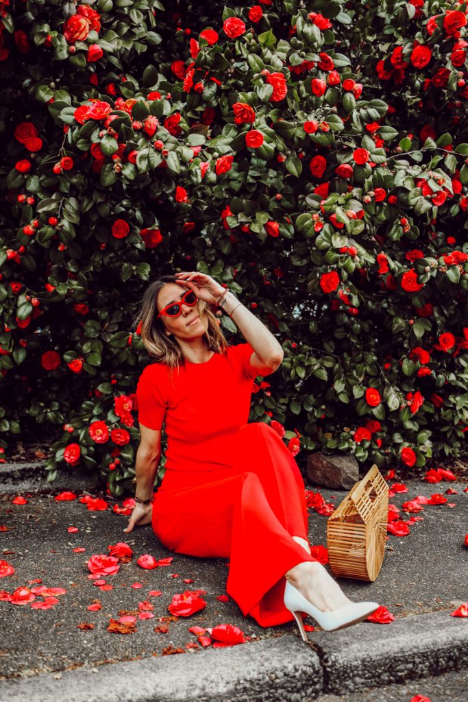Seattle Fashion Blogger Sportsanista wearing red ribbed shirt, red wide leg pants and white pumps