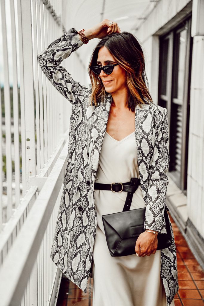 Seattle Fashion Blogger Sportsanista wearing animal print Mural Snakeskin Faux Leather Jacket and $10 Cat Eye Sunglasses on Smith Tower