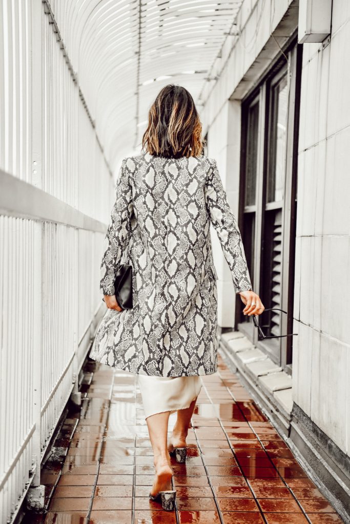 Seattle Fashion Blogger Sportsanista wearing Snakeskin coat over cream slip dress