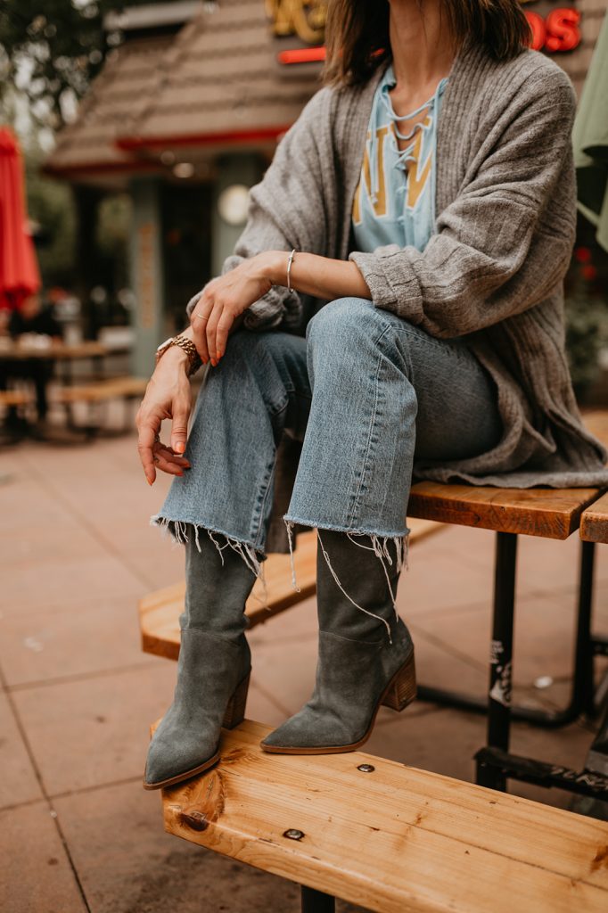 Seattle Fashion Blogger Sportsanista wearing Sam Edelman Suede Slouchy Boots and Levi's Cropped Denim for Game Day 