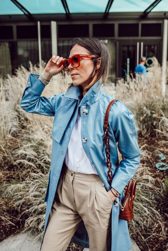 Seattle Blogger Mary Krosnjar wearing Blue Faux Leather Trench Coat and Quay Sunglasses 