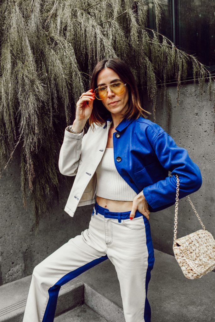Blogger Sportsanista wearing Cropped Denim Jacket with High Rise Flared Denim for spring look 